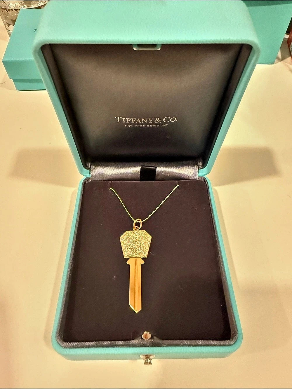 Tiffany & Co. Modern Keys Hexagon size 2” in 18k rose gold with beaded chain 16”